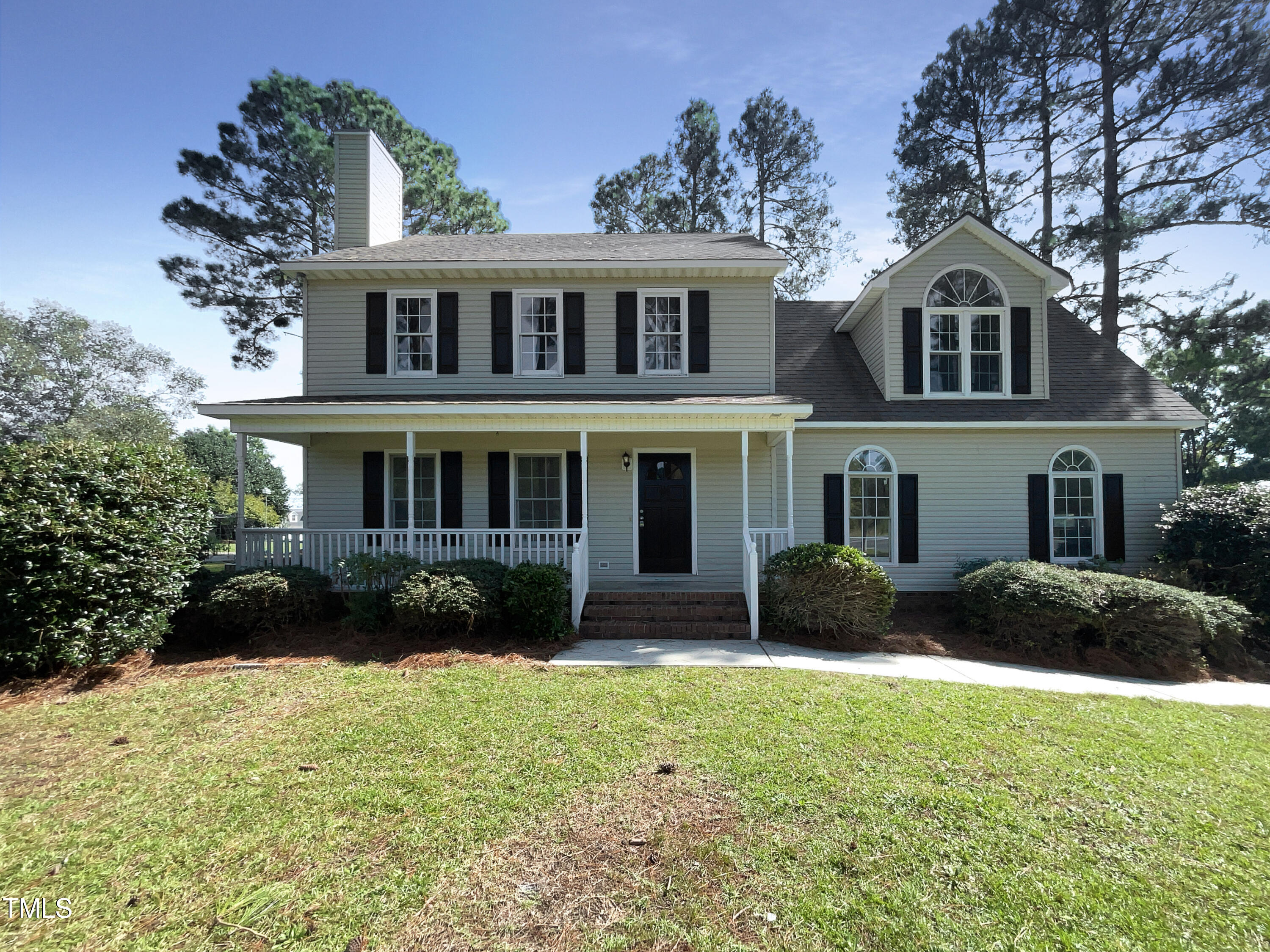 27 Pine Croft Road Angier, NC 27501 - Photo 1 of 19 a front view of a house with a yard and garage