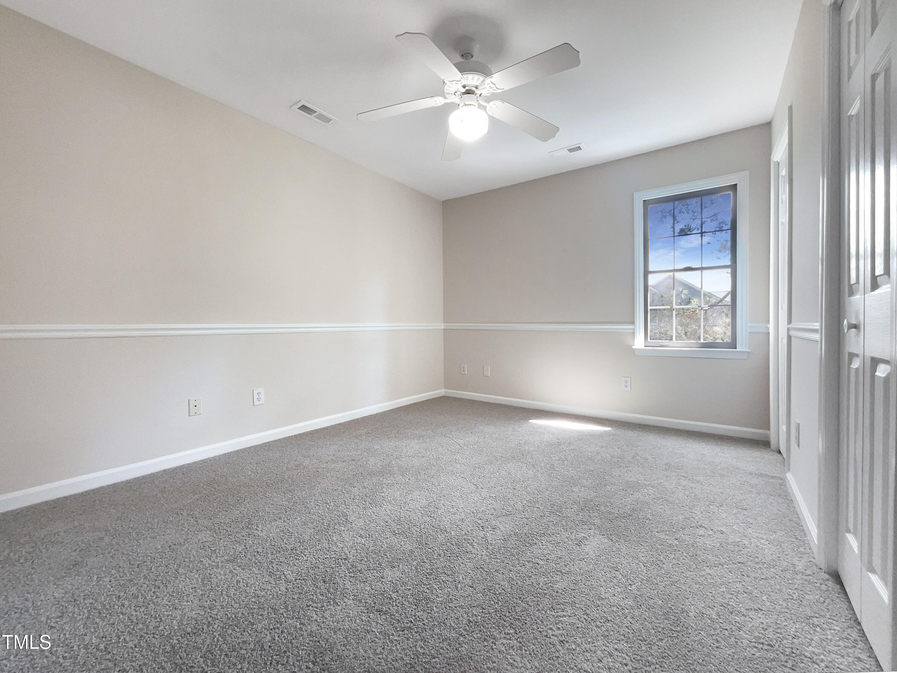 27 Pine Croft Road Angier, NC 27501 - Photo 12 of 19 an empty room with windows and fan
