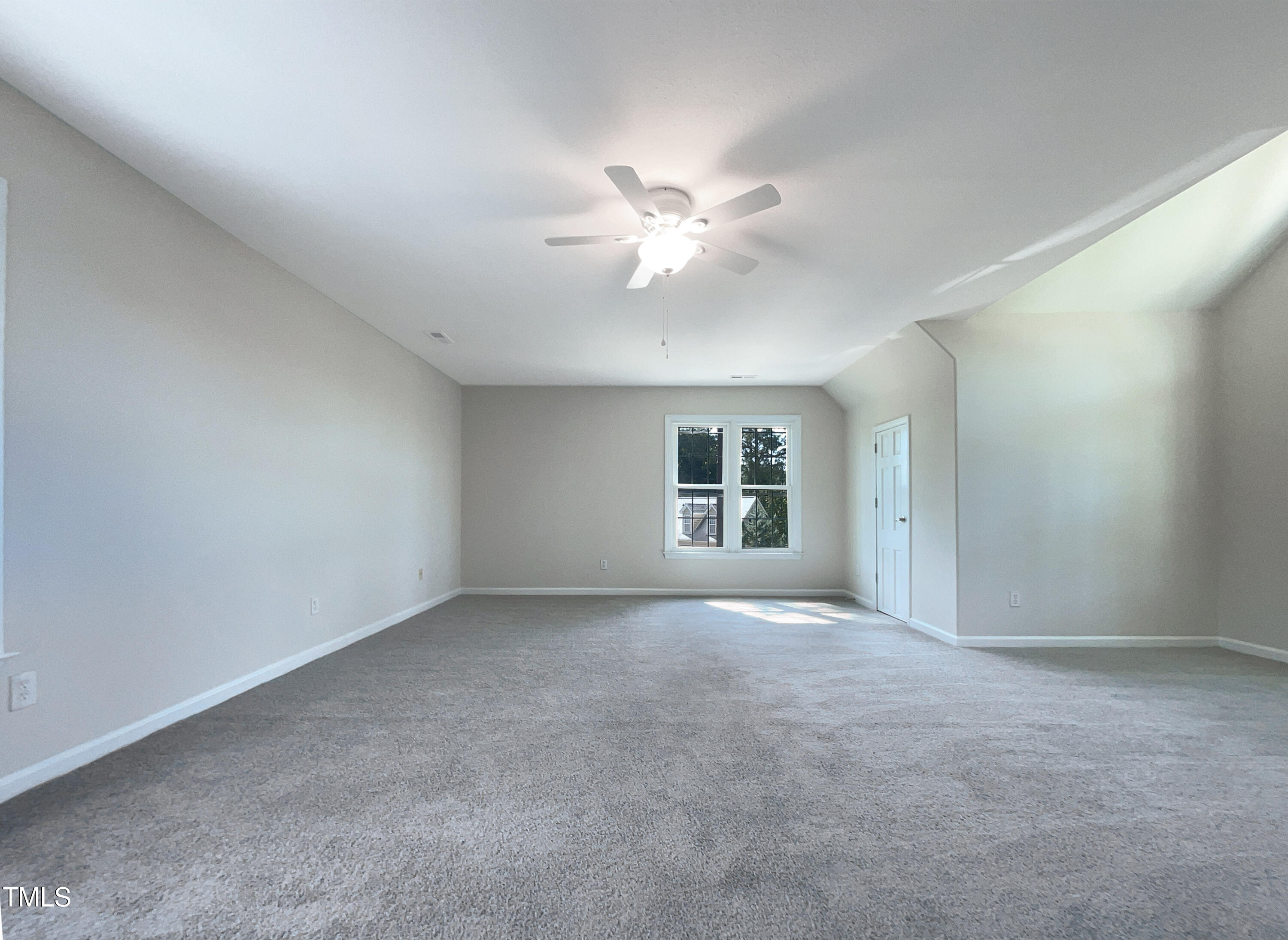 27 Pine Croft Road Angier, NC 27501 - Photo 15 of 19 an empty room with a window and a fan
