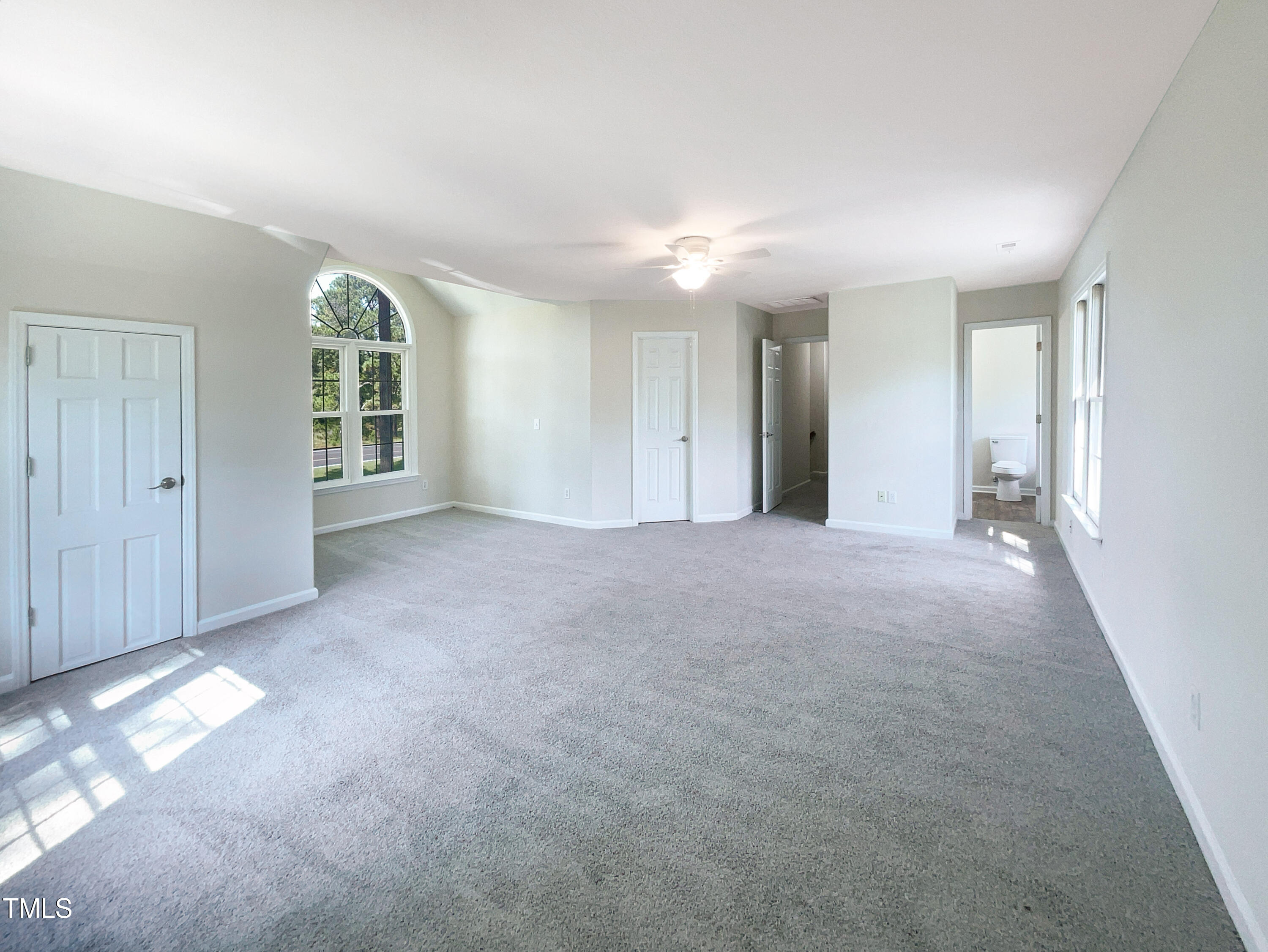 27 Pine Croft Road Angier, NC 27501 - Photo 16 of 19 an empty room with windows and entrance
