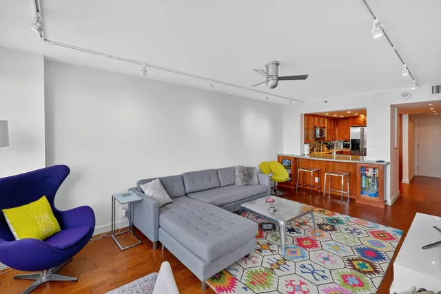 a bed room with a bed and a chandelier