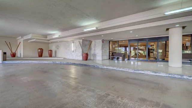 a view of a building with a yard