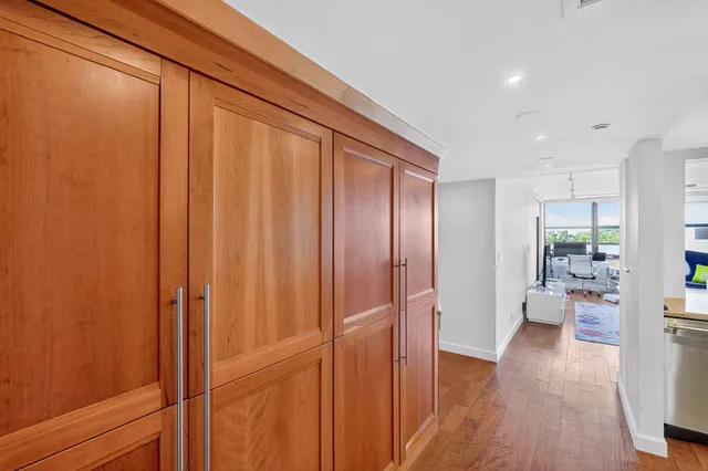 a kitchen with sink and view of living room
