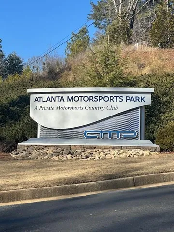 a view of a sign board with street