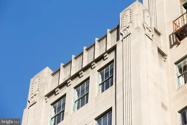 a white wall with a painting on it
