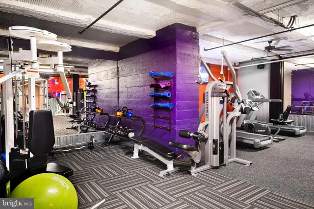 a view of a room with table and chairs