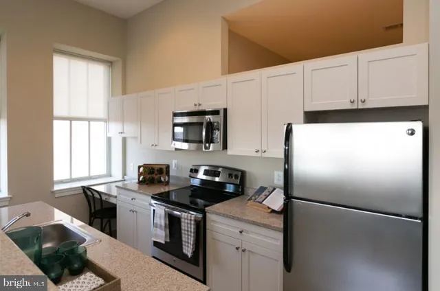 a bedroom with bed and window