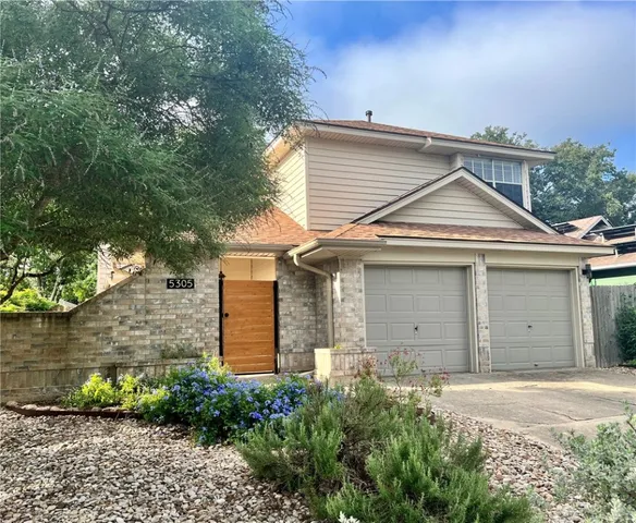 front view of a house and a yard