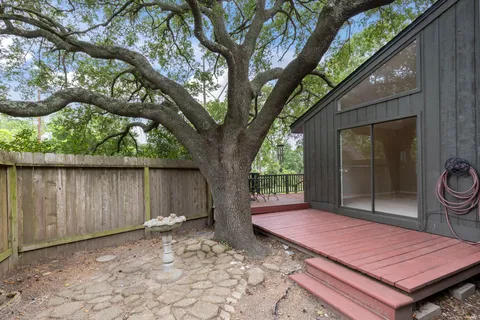 a backyard of a house with seating space