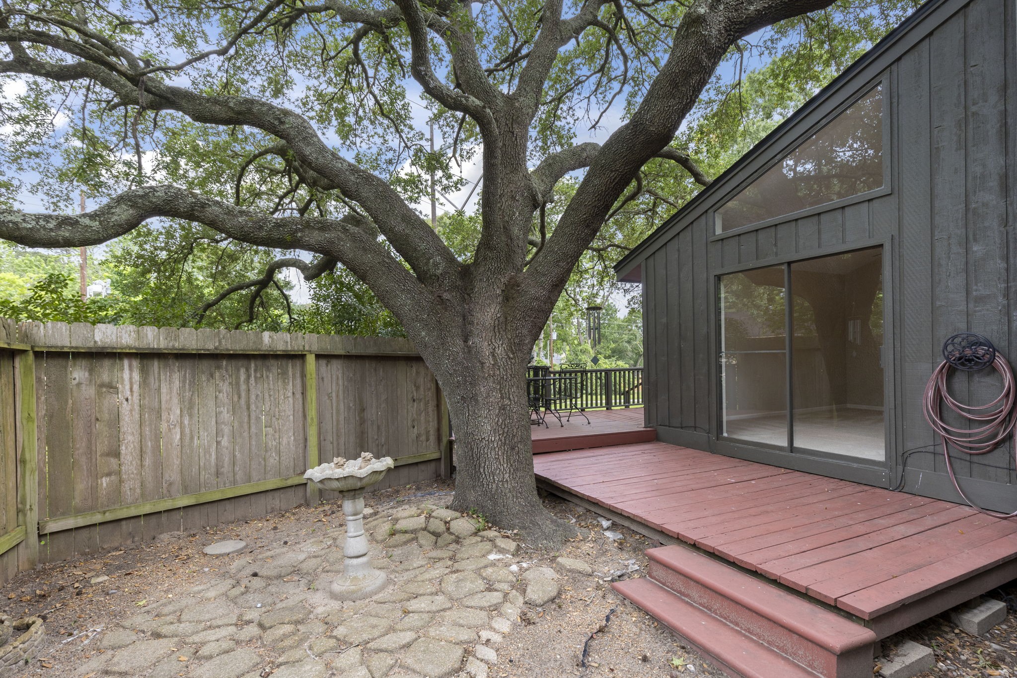 49 April Village Conroe, TX 77356 - Photo 21 of 46 a backyard of a house with seating space