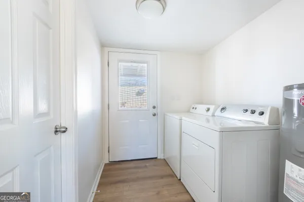 a utility room with dryer and washer