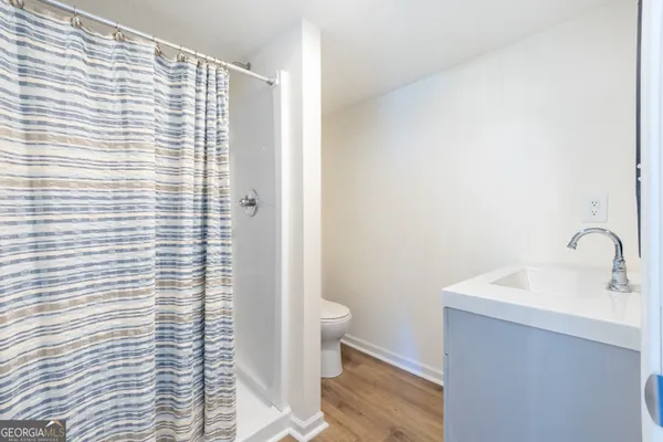 a bathroom with a sink and toilet
