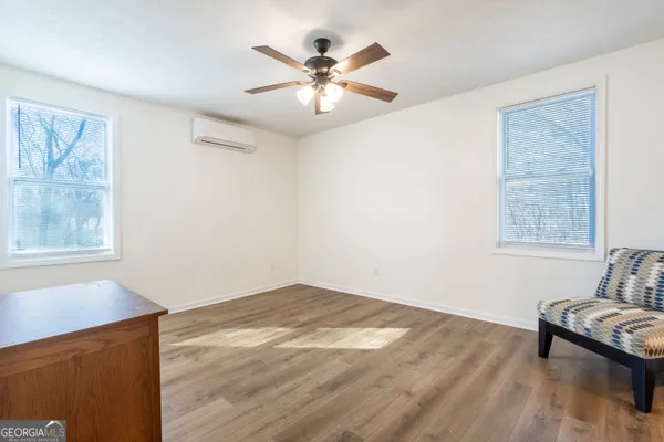 wooden floor in an empty room with a window