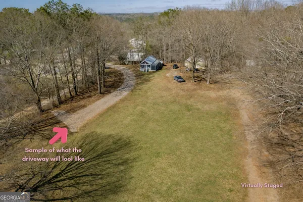 a view of a house with backyard and deck
