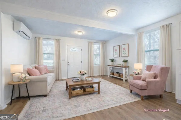 a living room with furniture and a large window