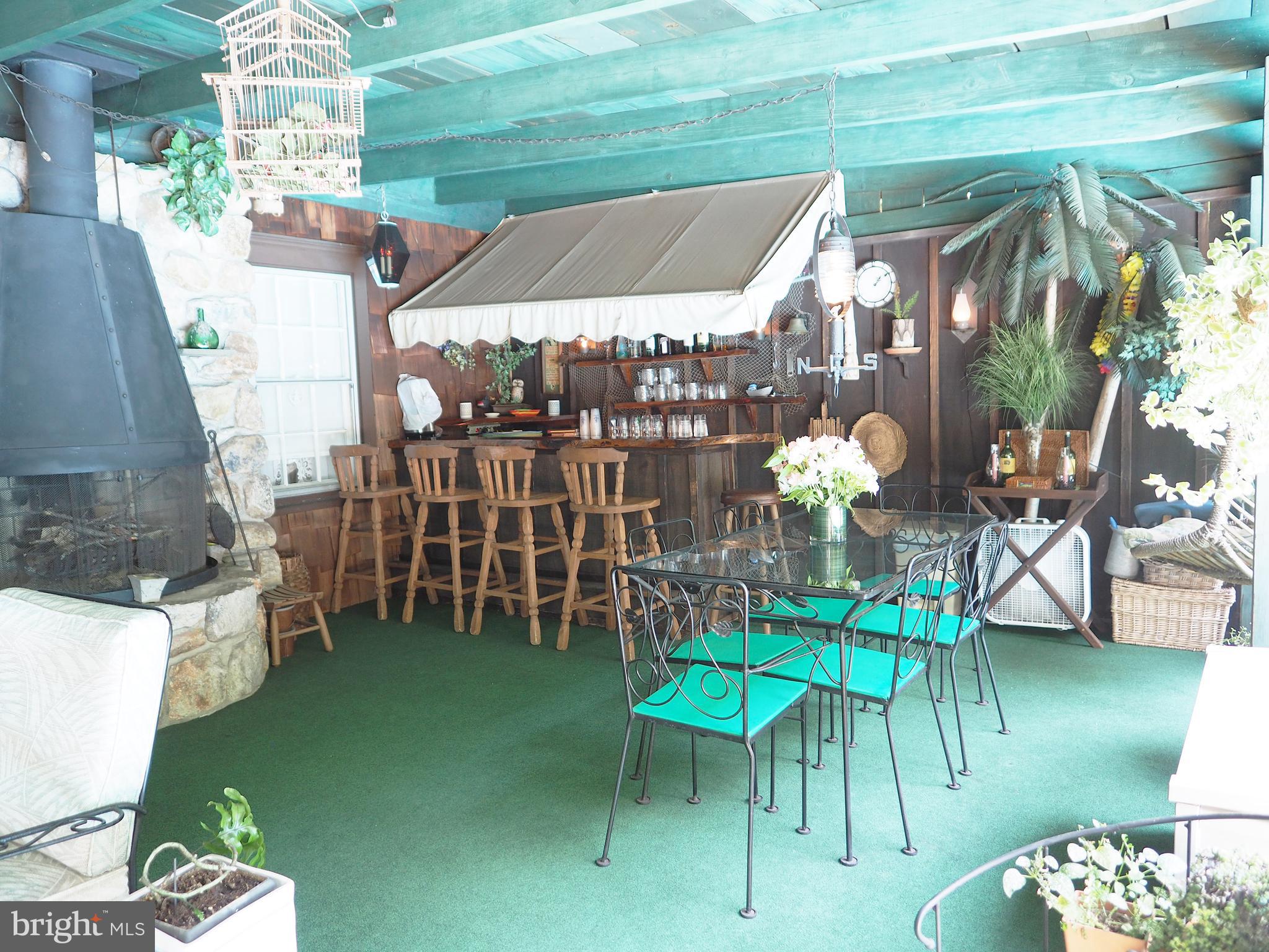 133 Loller Road Hatboro, PA 19040 - Photo 27 of 52 Outdoor bar and covered patio over looks pool.