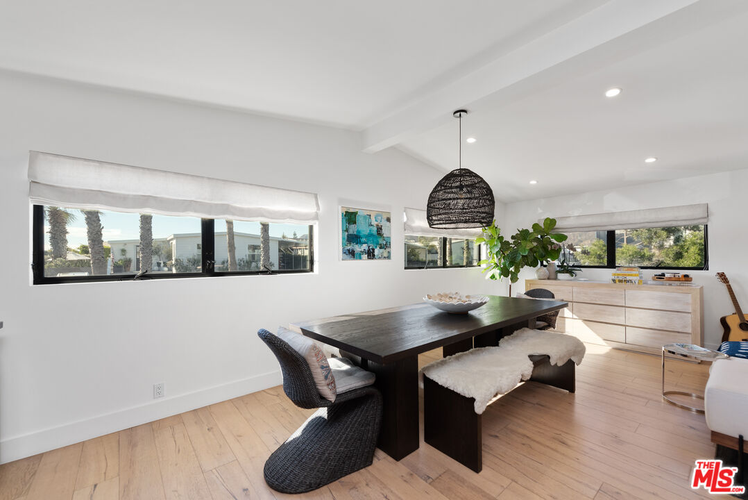 29500 Heathercliff Road, Unit 14 Malibu, CA 90265 - Photo 12 of 28 a living room with furniture and a wooden floor