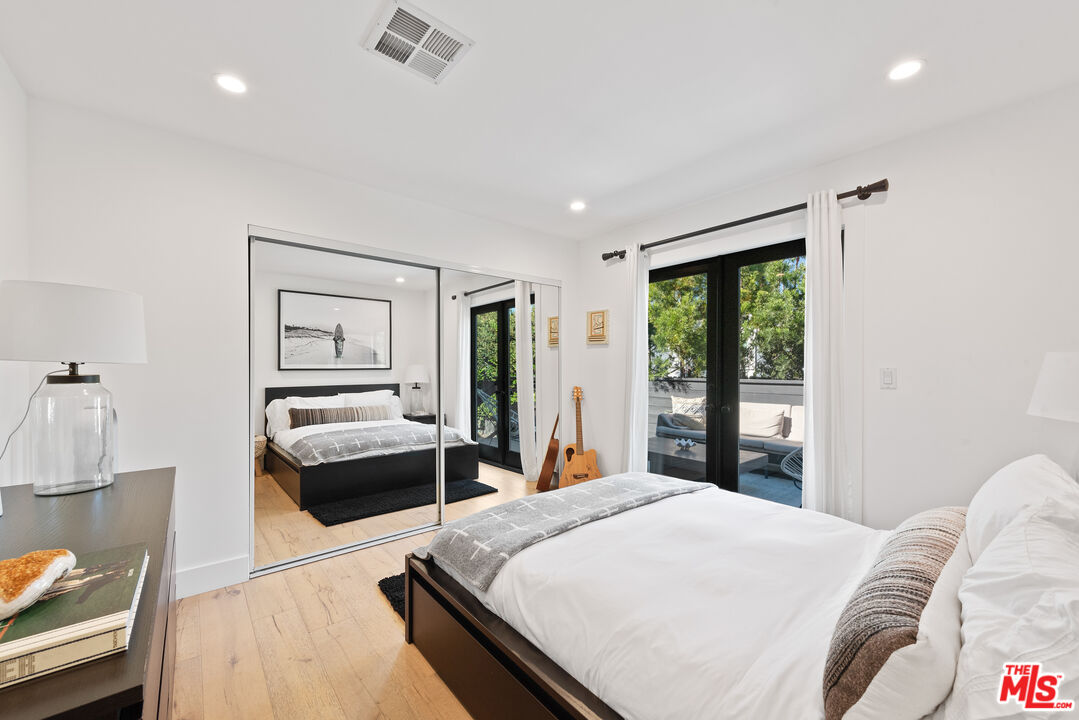 29500 Heathercliff Road, Unit 14 Malibu, CA 90265 - Photo 16 of 28 a bedroom with a large bed and a couch