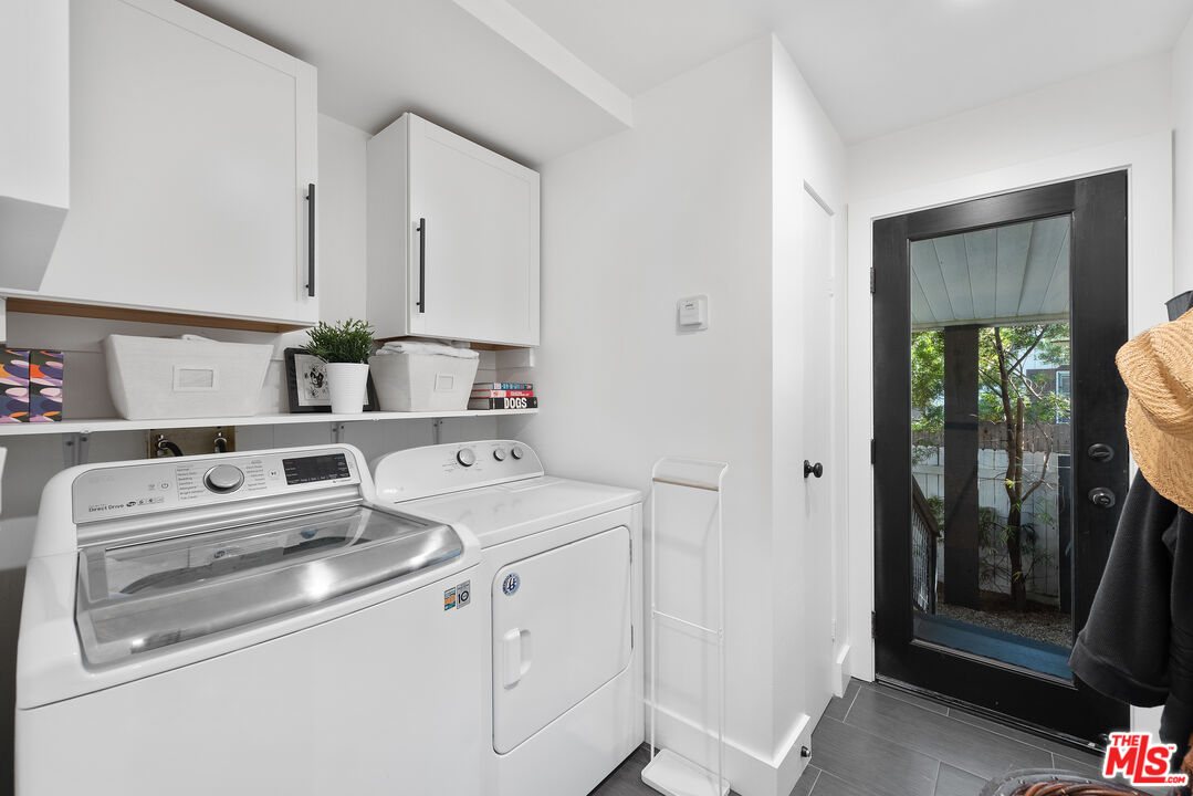 29500 Heathercliff Road, Unit 14 Malibu, CA 90265 - Photo 17 of 28 a utility room with dryer and washer