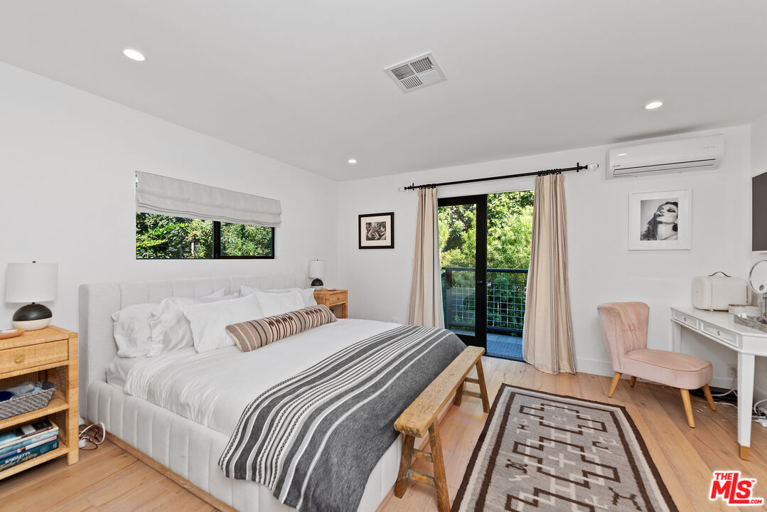 29500 Heathercliff Road, Unit 14 Malibu, CA 90265 - Photo 18 of 28 a bedroom with a large bed and a window