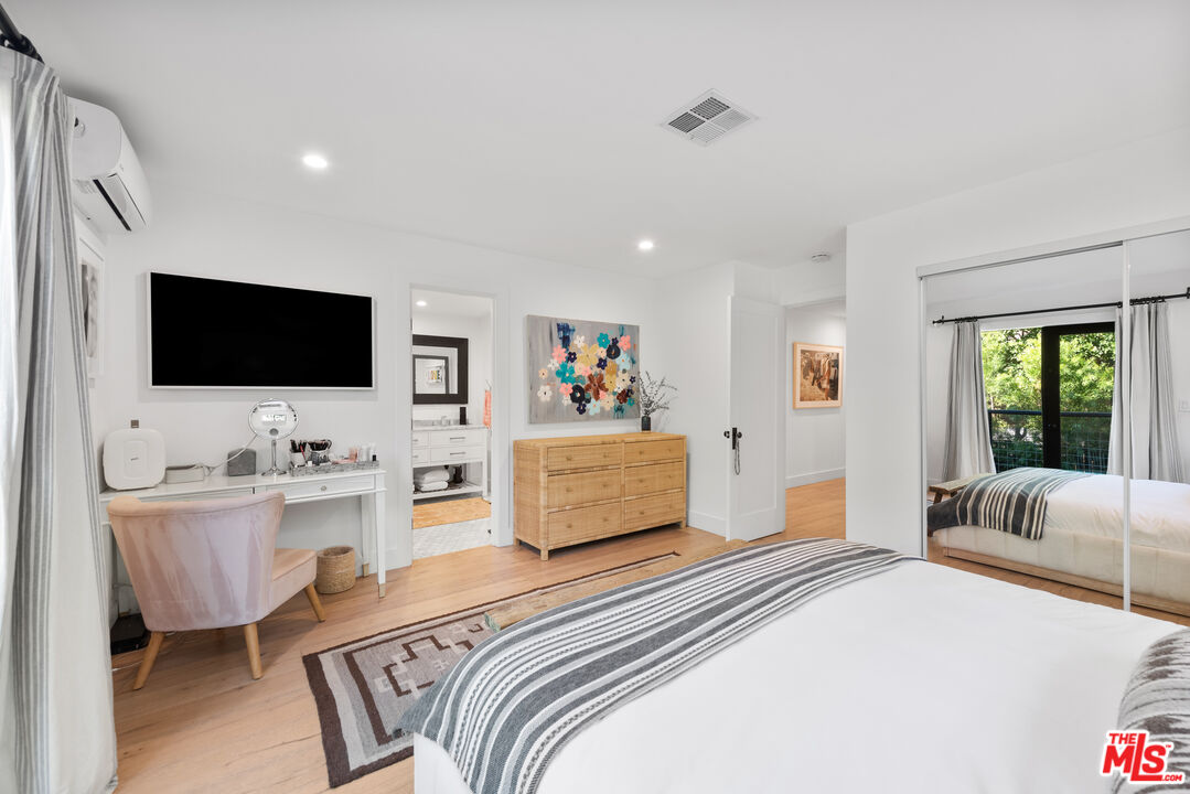 29500 Heathercliff Road, Unit 14 Malibu, CA 90265 - Photo 19 of 28 a bedroom with furniture and a flat screen tv