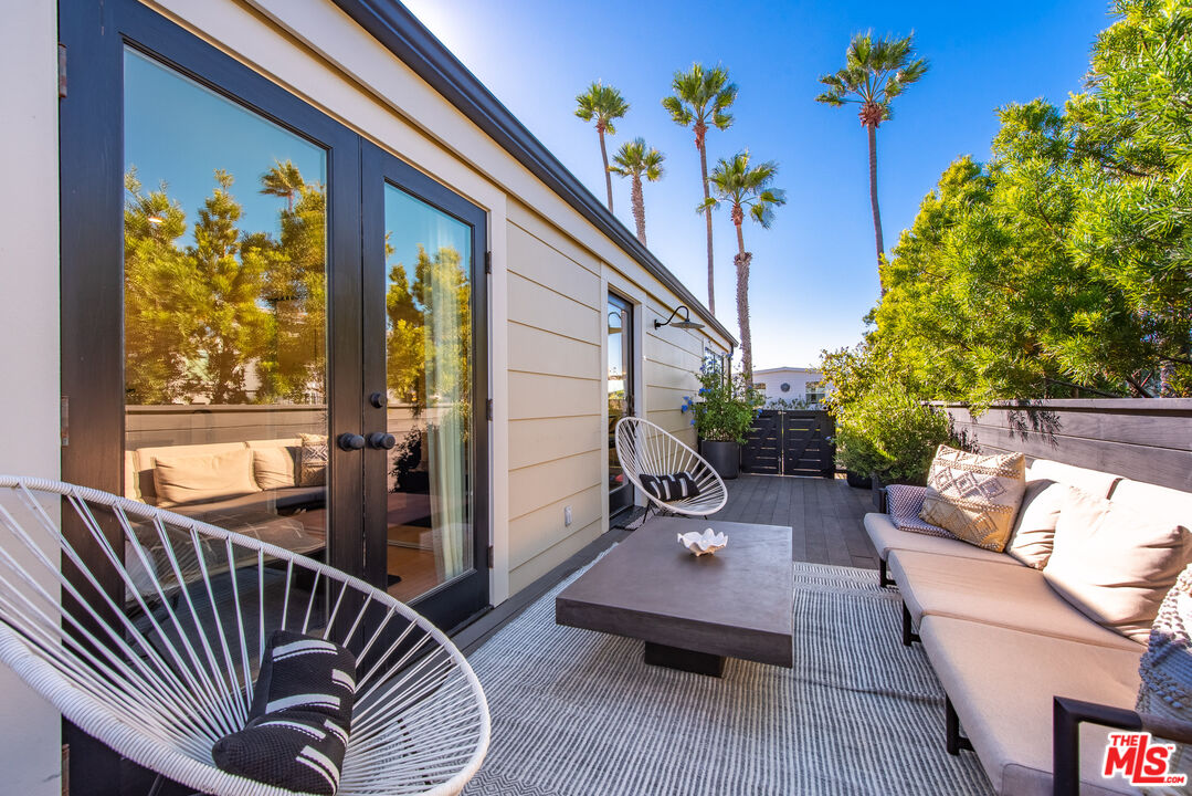 29500 Heathercliff Road, Unit 14 Malibu, CA 90265 - Photo 22 of 28 a balcony with furniture and a potted plant