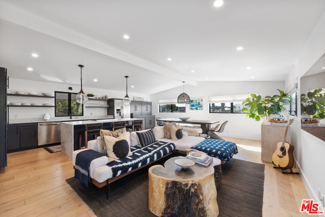 29500 Heathercliff Road, Unit 14 Malibu, CA 90265 - Photo 4 of 28 a living room with furniture and a wooden floor