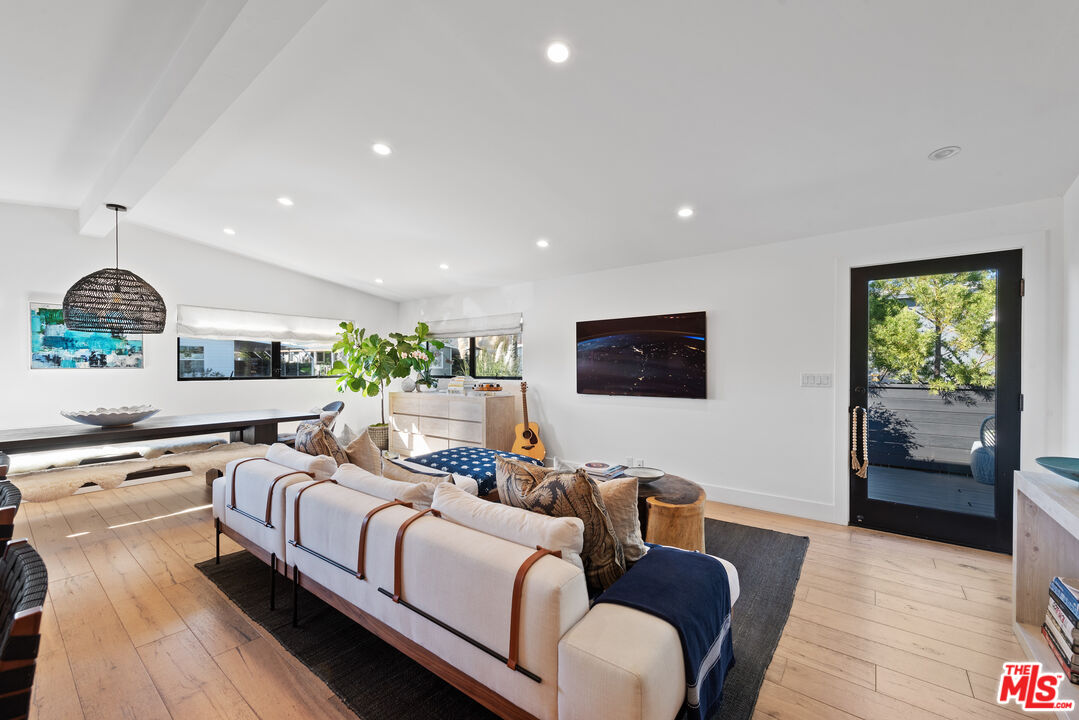 29500 Heathercliff Road, Unit 14 Malibu, CA 90265 - Photo 5 of 28 a living room with furniture and a flat screen tv