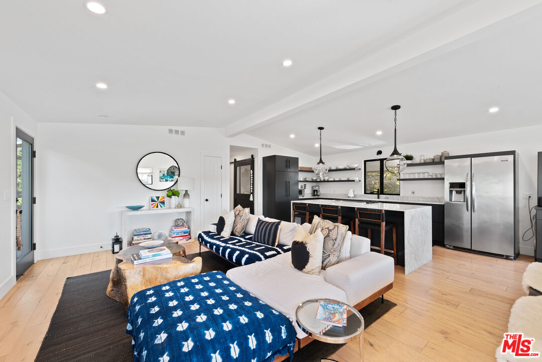 29500 Heathercliff Road, Unit 14 Malibu, CA 90265 - Photo 6 of 28 a living room with furniture and kitchen view
