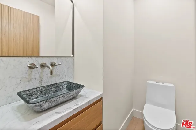 a bathroom with a toilet and a sink