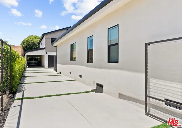 a front view of a house with large windows