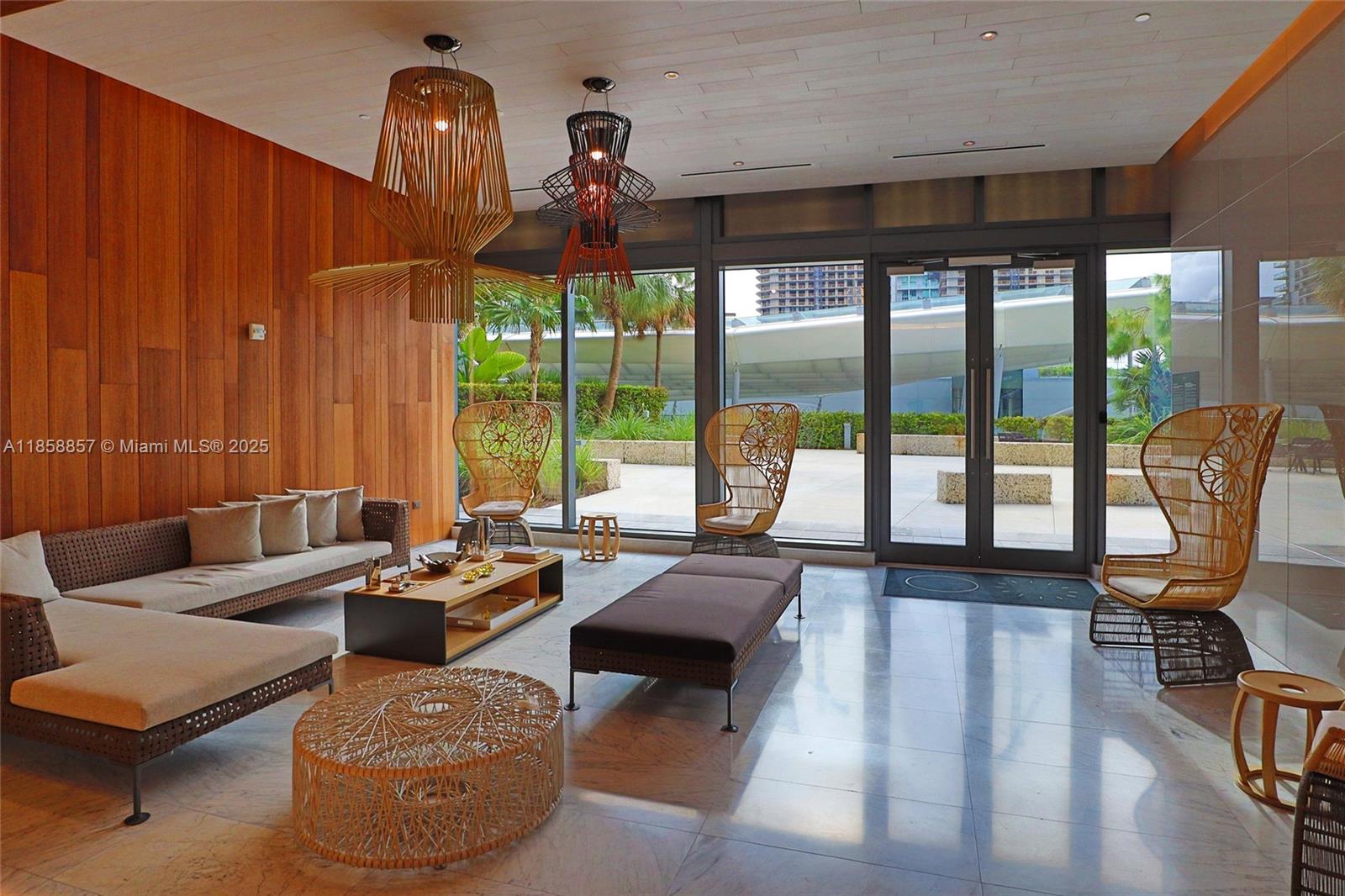 68 Southeast 6th Street, Unit 1008 Miami, FL 33131 - Photo 23 of 37 a living room with furniture and a large window