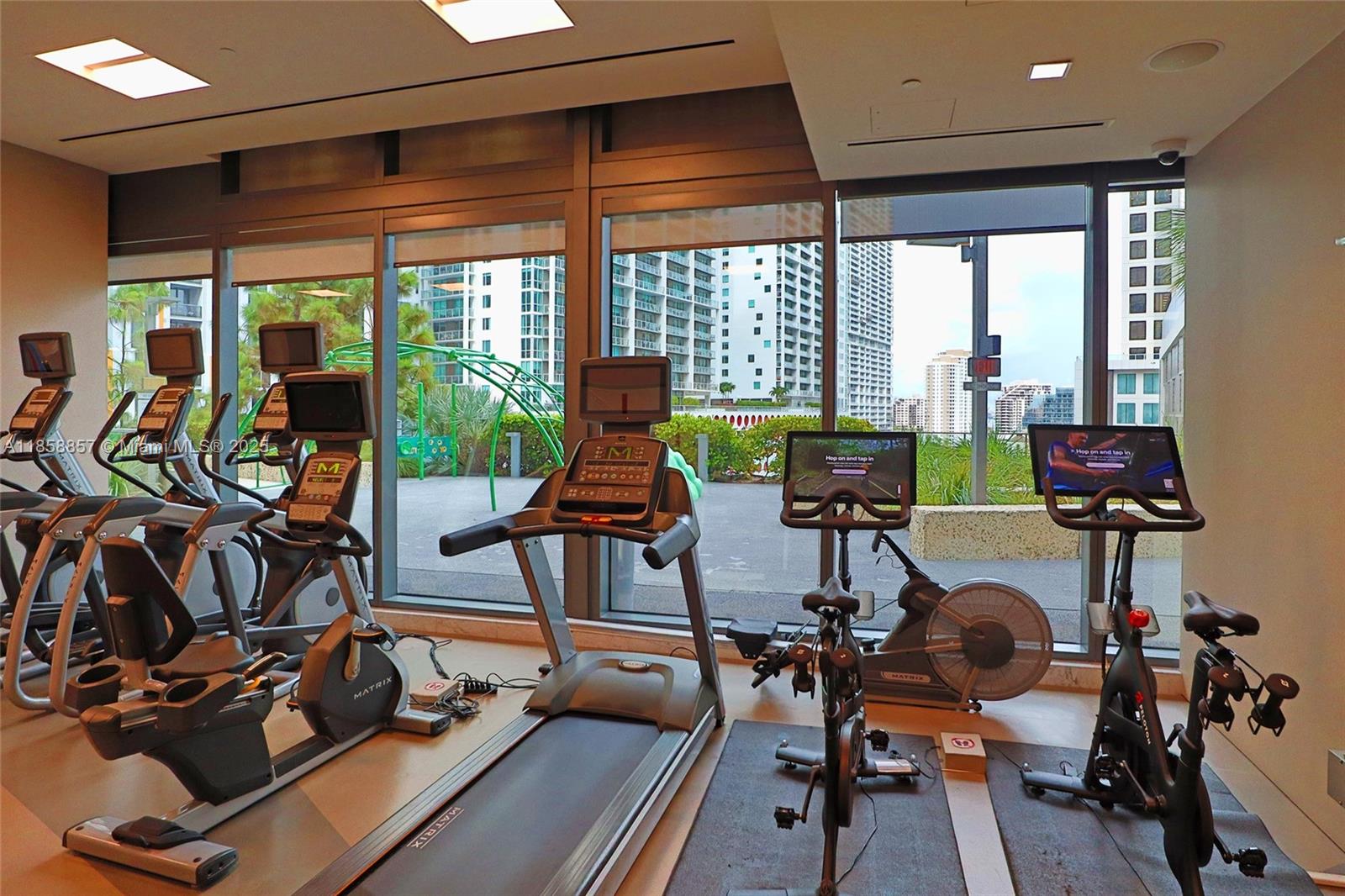 68 Southeast 6th Street, Unit 1008 Miami, FL 33131 - Photo 25 of 37 a view of a room with gym equipment