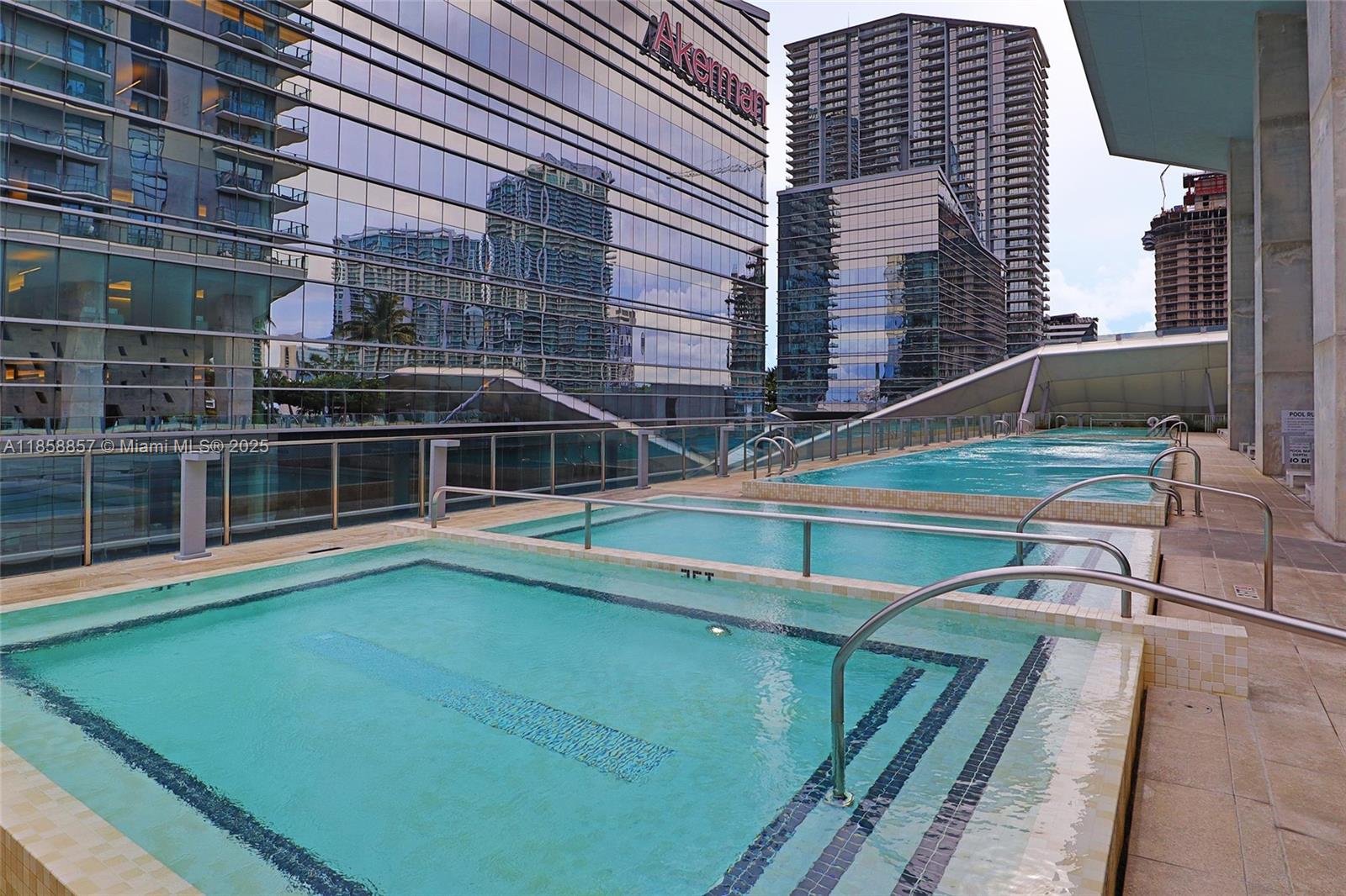 68 Southeast 6th Street, Unit 1008 Miami, FL 33131 - Photo 29 of 37 a view of a house with a swimming pool