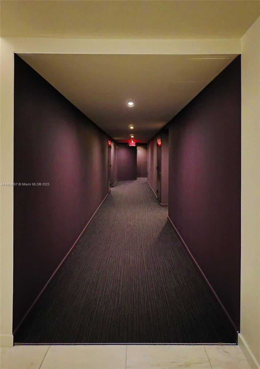 68 Southeast 6th Street, Unit 1008 Miami, FL 33131 - Photo 33 of 37 a view of gallery with wooden floor