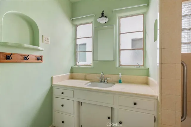 a bathroom with a sink and a mirror