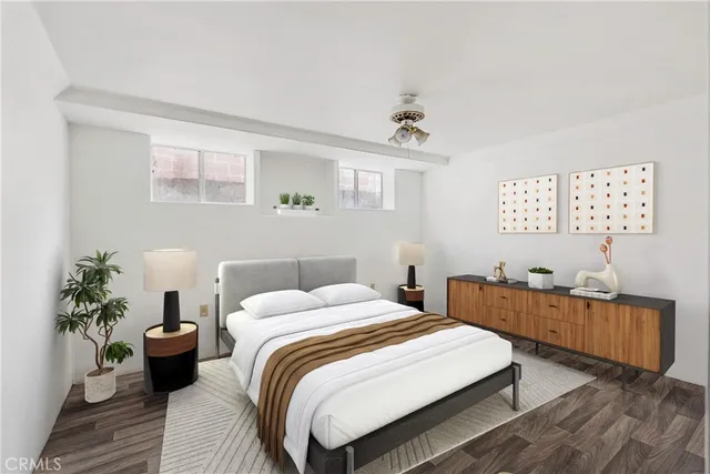 a bedroom with a bed and a table chair