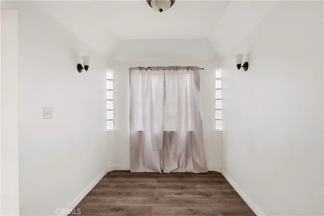 a view of entryway with wooden floor