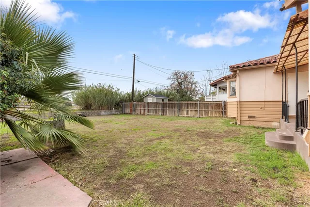 a view of a house with a yard and garage