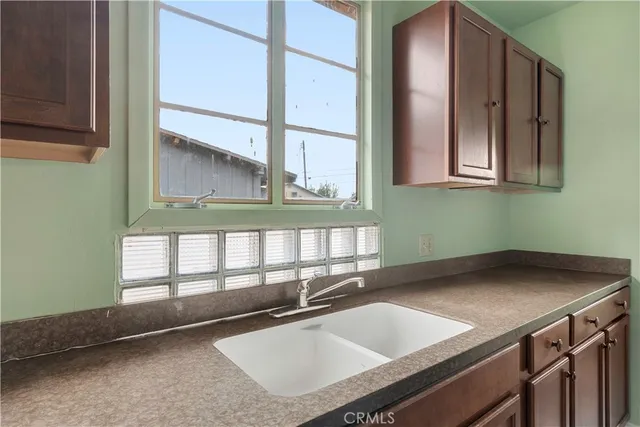 a bathroom with a sink and a window