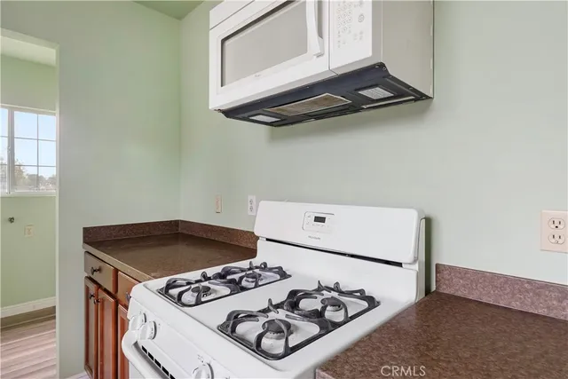 a kitchen with a stove and a microwave
