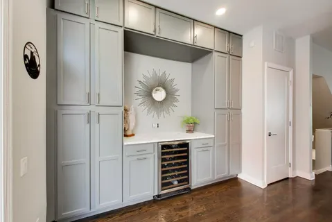 a kitchen with a refrigerator and a sink