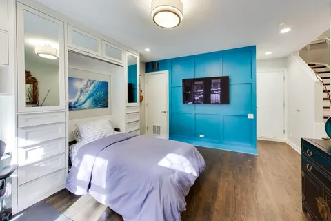 a bedroom with a bed and a view of bathroom