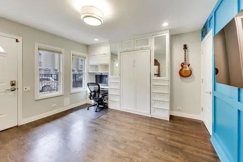 a view of a livingroom with furniture and a window