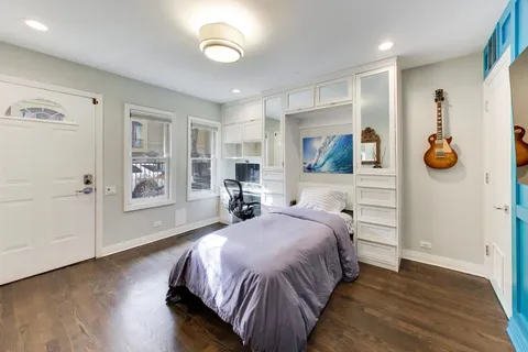 a spacious bedroom with a bed and a window
