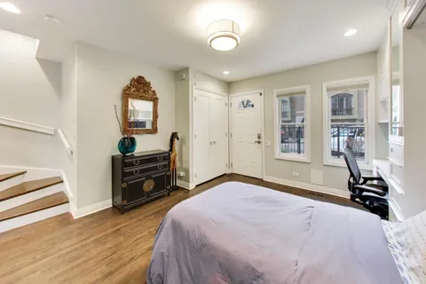 a bedroom with furniture and a window