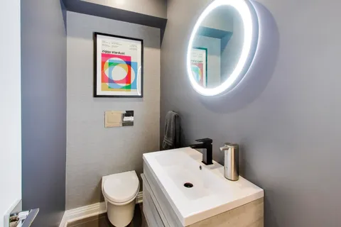 a bathroom with a toilet and a sink