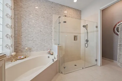 a bedroom with a bed window and couch