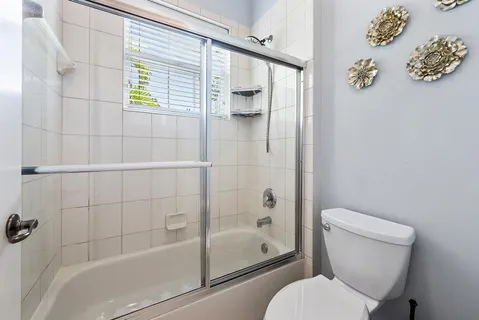 a view of storage and utility room with washer and dryer