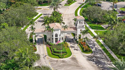 a living room with furniture chandelier and a large window